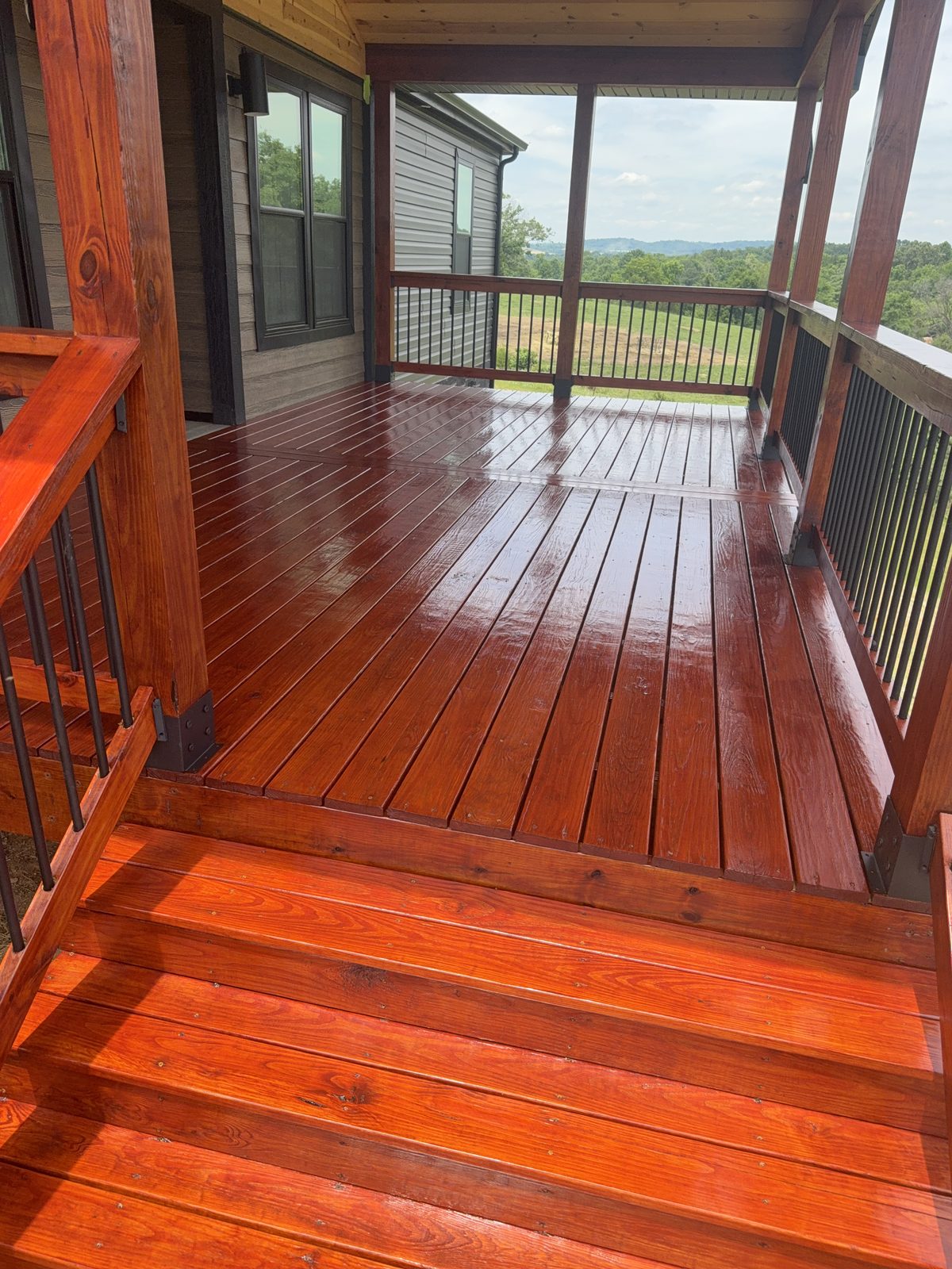 Finished PPG ProLuxe Mahogany deck and railings overlooking East Tennessee farmland